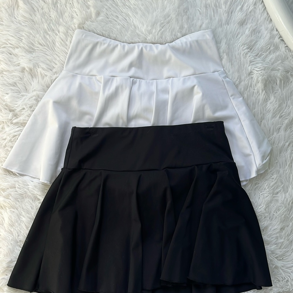 2 black and white skirts from halara